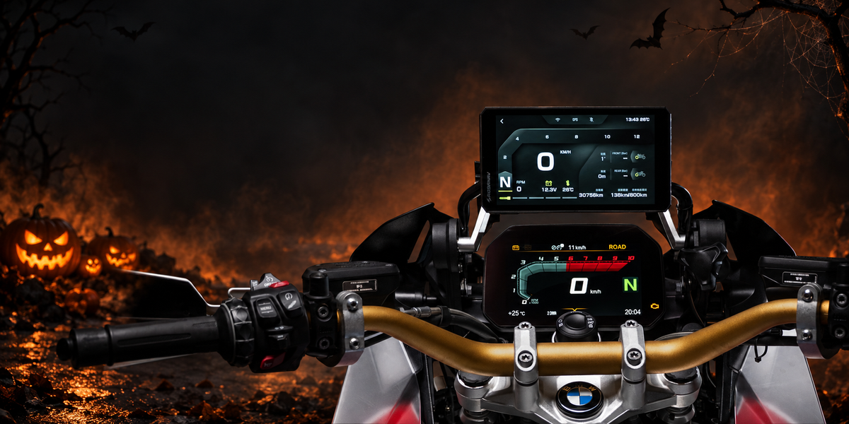 RiderNav motorcycle displays and auxiliary lights in a Halloween studio scene